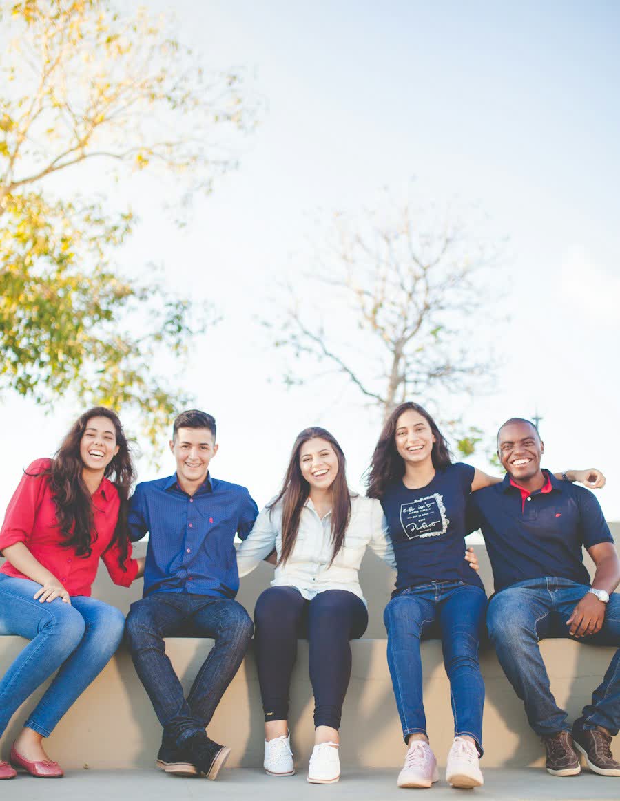 Group of university students smiling together outdoors