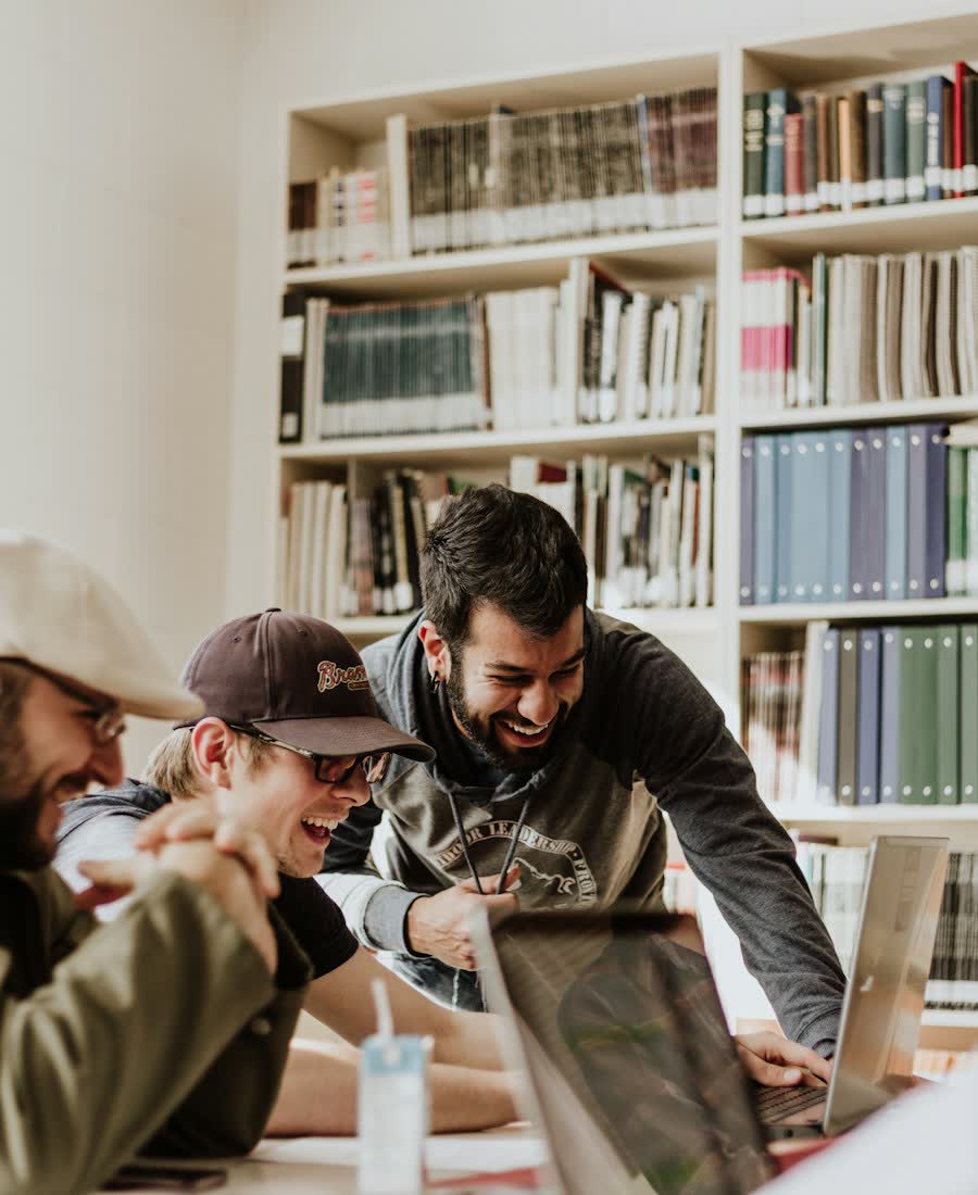 University students collaborating in the library